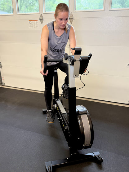 Woman exercising on a stationary bike in a home setting