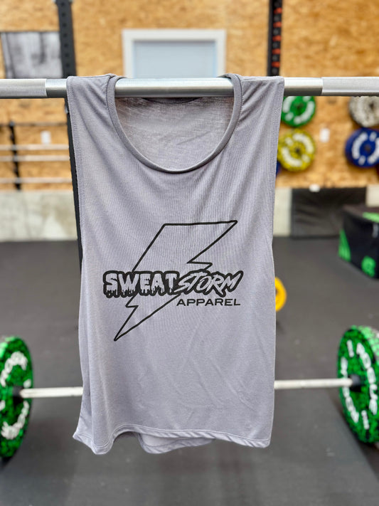 Gray tank top with 'Sweat Storm Apparel' logo hanging on a barbell in a gym setting.